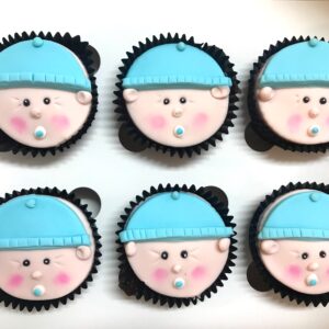 baby face cupcakes in blue