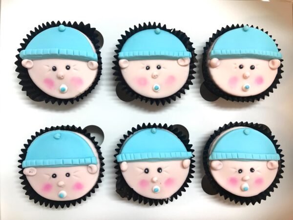 baby face cupcakes in blue