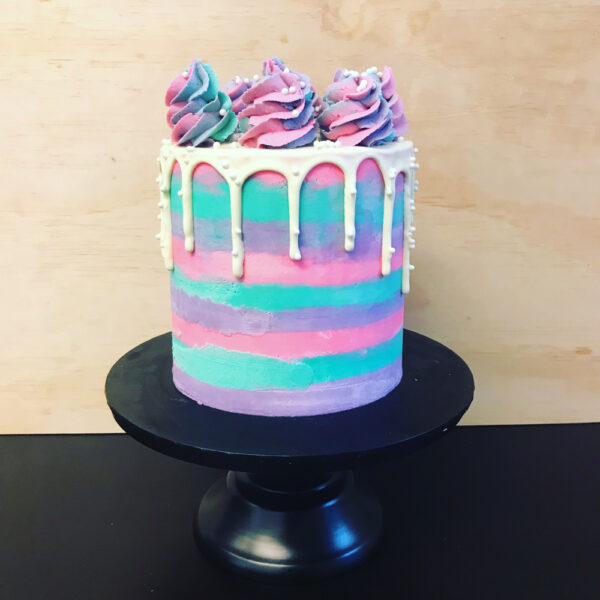 girly rainbow drip cake