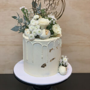 white floral drip cake