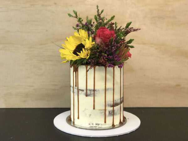semi naked drip cake with flowers