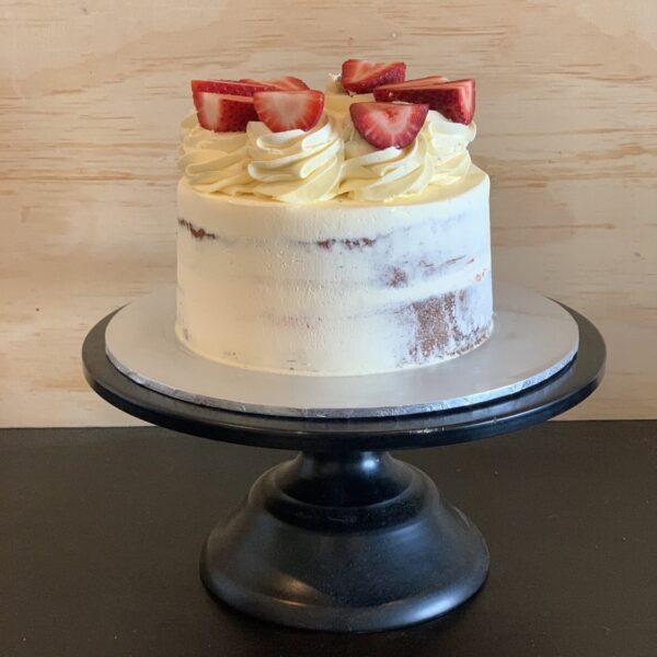 semi naked cake with cream and strawberries