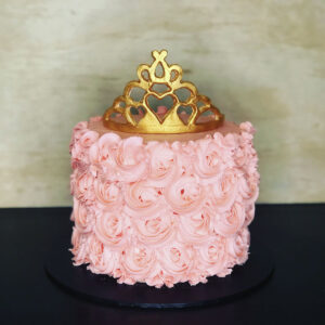 Pink princess cake with golden crown